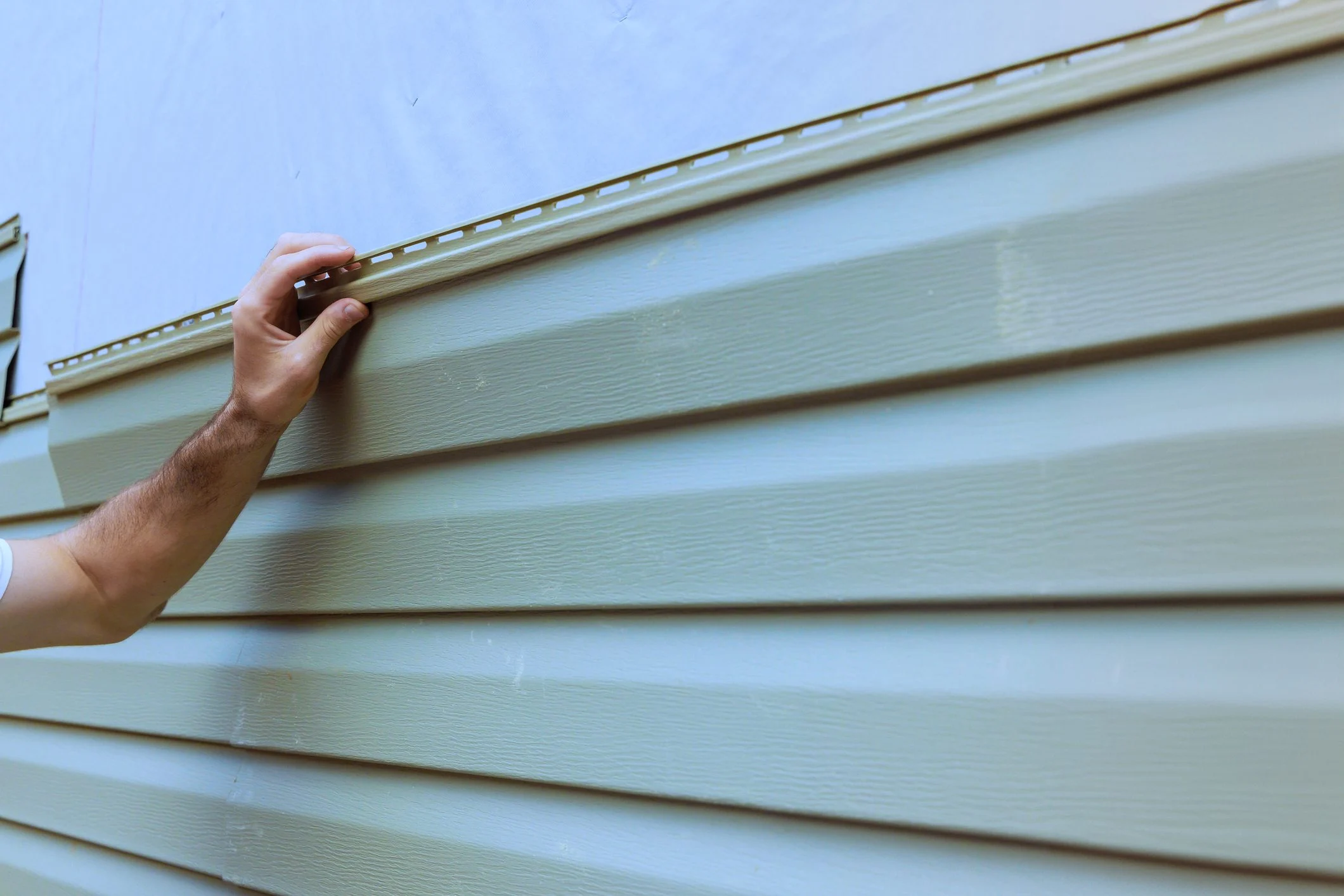 house with new vinyl siding installation